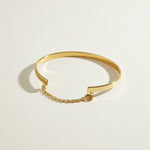 gold cuff bracelet, flat bangle bracelet, open cuff bracelet, minimalist gold bracelet, bracelet with chain closure, safety chain bracelet, stackable bangle, polished gold cuff, thin gold cuff bracelet, modern gold bracelet, everyday gold bracelet, wrist stack jewelry, gift for her