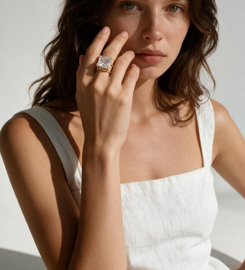 princess cut cocktail ring on model, statement crystal ring lifestyle, double band ring on hand, gold cocktail ring editorial, oversized crystal ring styled, heart detail ring on model
