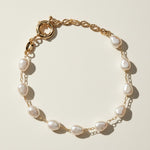 baroque pearl bracelet flat lay, freshwater pearl bracelet, gold chain pearl bracelet, adjustable pearl bracelet clasp, handcrafted baroque pearl jewelry, pearl and gold chain bracelet, statement clasp pearl bracelet, organic pearl bracelet detail