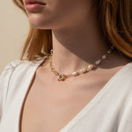 baroque pearl necklace, front toggle clasp necklace, freshwater pearl chain necklace, gold and pearl necklace on model, organic pearl necklace, statement clasp pearl necklace, dainty pearl choker, pearl necklace close-up