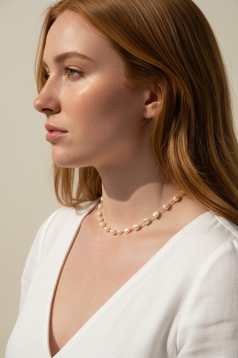 baroque pearl necklace, front toggle clasp necklace, freshwater pearl chain necklace, gold and pearl necklace on model, organic pearl necklace, statement clasp pearl necklace, dainty pearl choker, pearl necklace close-up