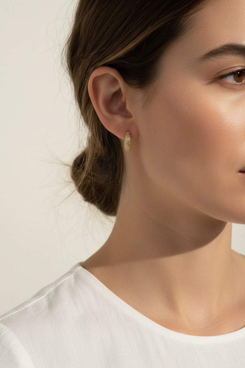 textured gold hoop earrings, stardust gold earrings, granulated gold huggie hoops, textured dome earrings on model, gold hoop earrings close-up, sparkly textured hoops, tapered gold huggie earrings, everyday gold hoop earrings