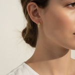 textured gold hoop earrings, stardust gold earrings, granulated gold huggie hoops, textured dome earrings on model, gold hoop earrings close-up, sparkly textured hoops, tapered gold huggie earrings, everyday gold hoop earrings