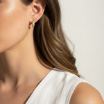 textured gold hoop earrings, stardust gold earrings, granulated gold huggie hoops, textured dome earrings on model, gold hoop earrings close-up, sparkly textured hoops, tapered gold huggie earrings, everyday gold hoop earrings
