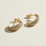 textured gold hoop earrings flat lay, pave dome hoop earrings, sparkly textured hoops detail, micro CZ gold hoops, stardust texture earrings, tapered gold huggie hoops, sugared gold earrings, statement pave hoops
