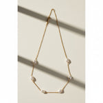gold pearl station necklace, freshwater pearl chain necklace, pearls by the yard necklace, gold necklace with pearls, dainty pearl necklace, pearl clasp necklace, gold chain pearl jewelry, delicate pearl necklace flat lay