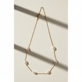 gold pearl station necklace, freshwater pearl chain necklace, pearls by the yard necklace, gold necklace with pearls, dainty pearl necklace, pearl clasp necklace, gold chain pearl jewelry, delicate pearl necklace flat lay