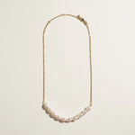 gold pearl cluster necklace, freshwater pearl bar necklace, clustered pearl necklace, modern pearl necklace, gold chain pearl necklace, asymmetric pearl necklace, dainty pearl cluster jewelry, pearl necklace flat lay