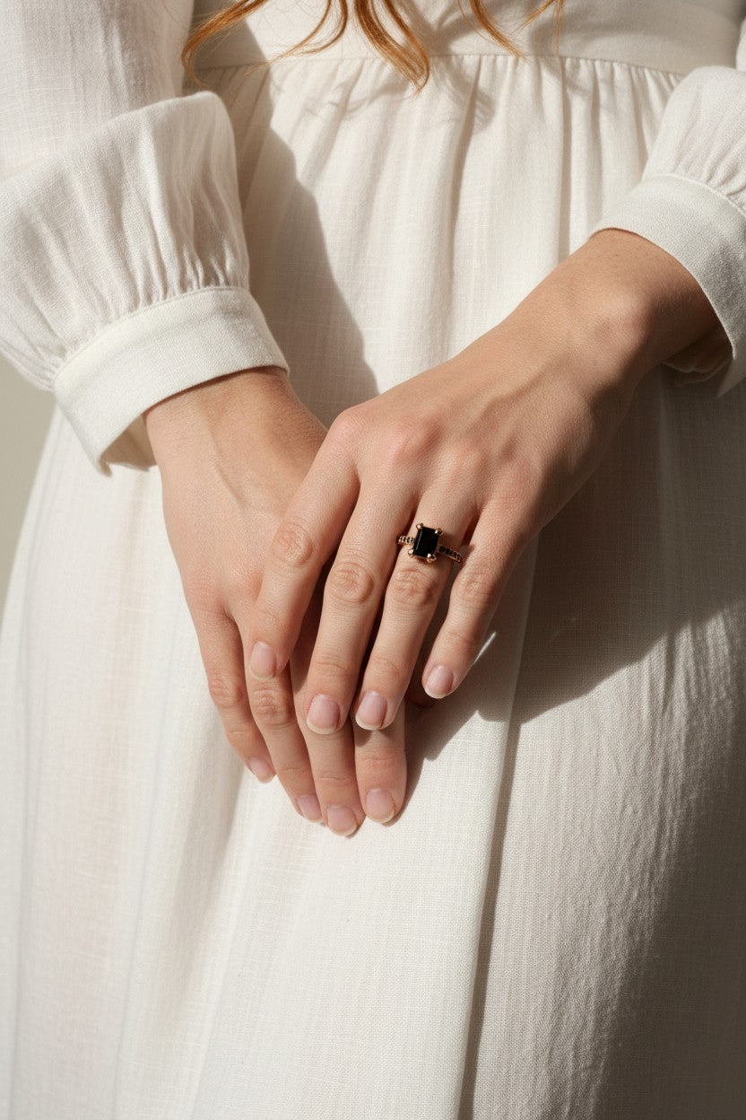 black stone cocktail ring, emerald cut ring detail, black onyx ring gold, vintage statement ring, art deco ring, pavé black stone band, gold prong setting ring, cocktail ring flat lay