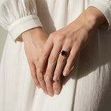 black stone cocktail ring, emerald cut ring detail, black onyx ring gold, vintage statement ring, art deco ring, pavé black stone band, gold prong setting ring, cocktail ring flat lay
