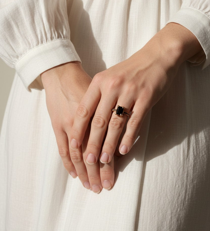 black stone cocktail ring, emerald cut ring detail, black onyx ring gold, vintage statement ring, art deco ring, pavé black stone band, gold prong setting ring, cocktail ring flat lay