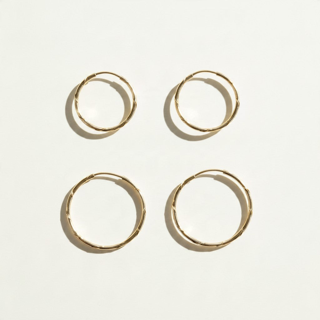 gold endless hoop earrings, textured gold hoops, diamond-cut hoop earrings, thin gold hoops, lightweight hoop earrings, twist hoop earrings, minimalist gold hoops, everyday hoop earrings, sleeper hoops, small and large gold hoops, hoop earrings size guide, women’s gold hoops