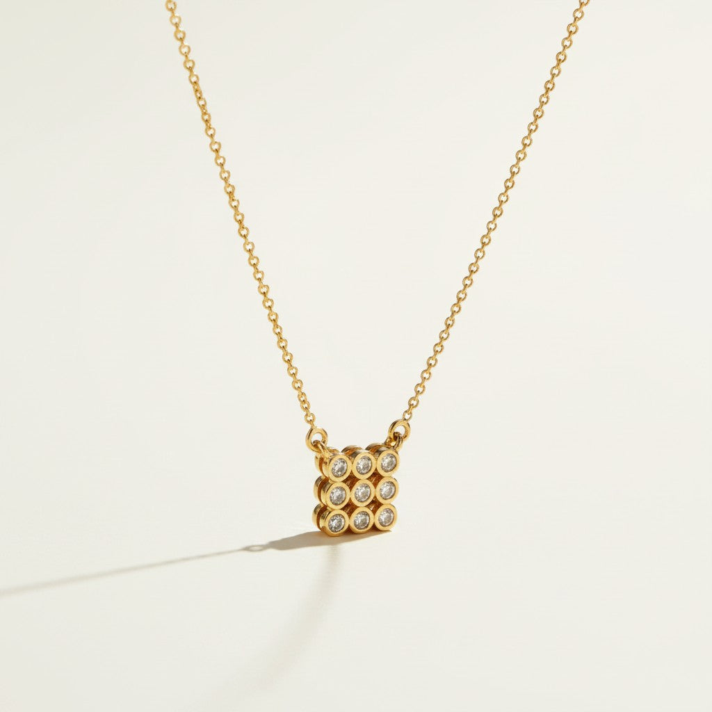 pave cluster pendant necklace, crystal pendant necklace detail, bezel set pendant, 18K gold overlay necklace, dainty crystal necklace, minimalist pendant necklace, sparkly pendant flat lay, cable chain necklace