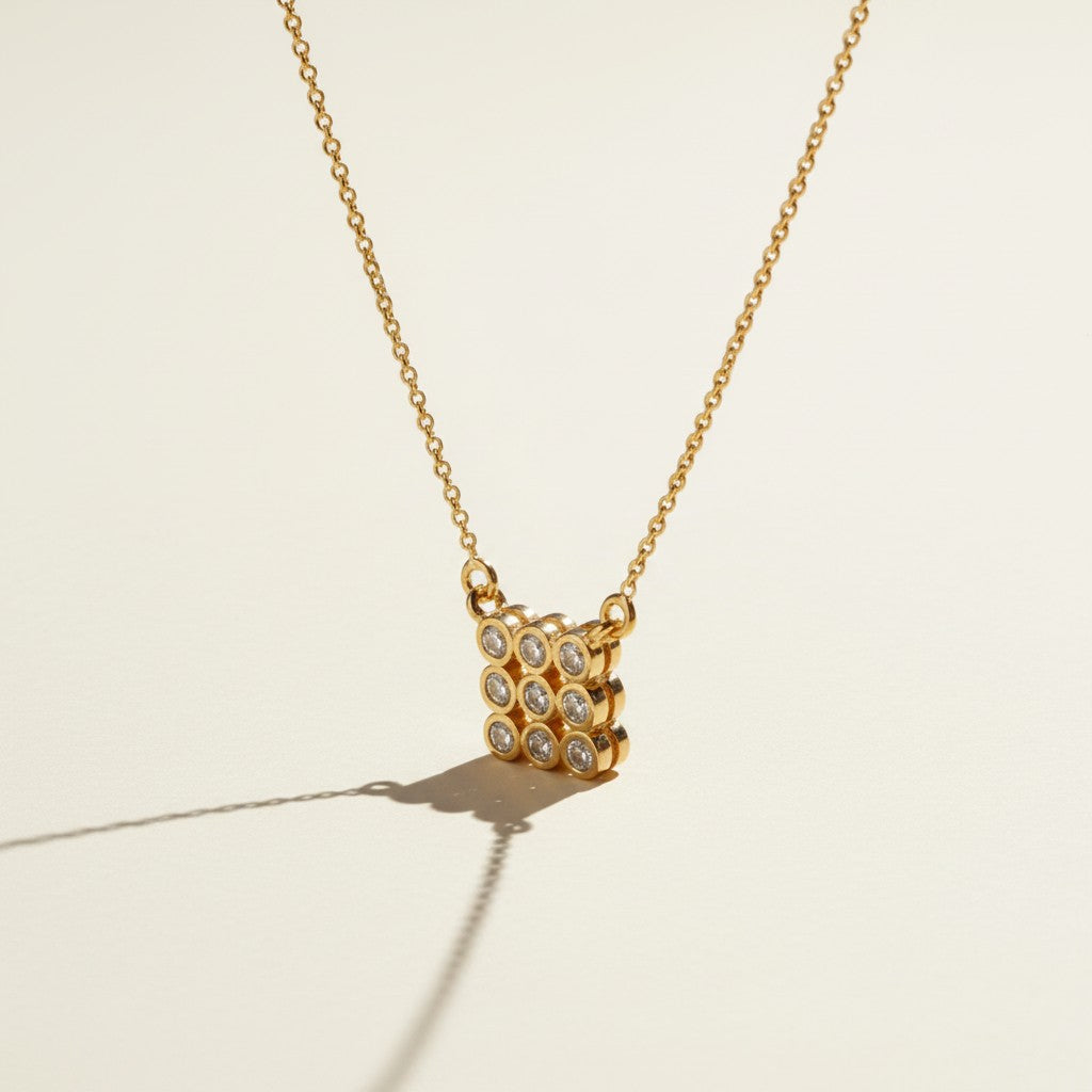 pave cluster pendant necklace, crystal pendant necklace detail, bezel set pendant, 18K gold overlay necklace, dainty crystal necklace, minimalist pendant necklace, sparkly pendant flat lay, cable chain necklace