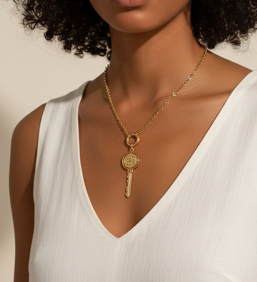 gold key necklace, saint medallion key pendant, religious key jewelry, statement gold necklace, symbolic pendant necklace, vintage medal key necklace, textured gold necklace, bold drop pendant