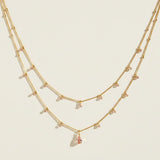 layered gemstone necklace, multicolor beaded chain necklace, gold layered necklace set, gemstone drop pendant necklace, emerald pink black crystal necklace, dainty beaded necklace, layered necklace colorways, gold chain necklace detail