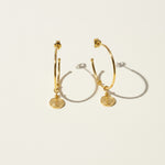 gold coin charm earrings, coin hoop earrings, gold hoop earrings with charm, vintage coin jewelry, dangle hoop earrings flat lay, medallion earrings, engraved coin earrings, everyday gold jewelry