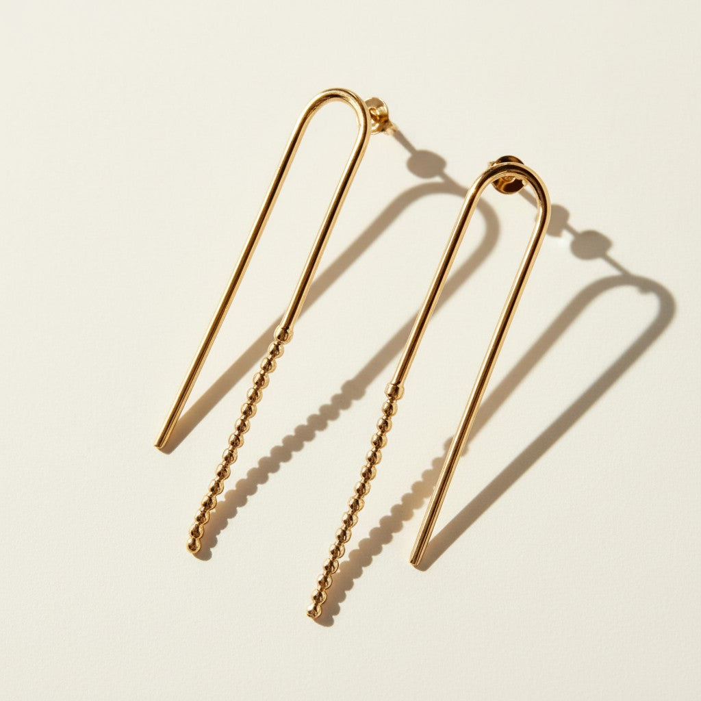 arch drop earrings, beaded wire earrings, gold U-shaped earrings, minimalist drop earrings, linear gold earrings, long wire earrings, geometric drop earrings, stud post drop earrings