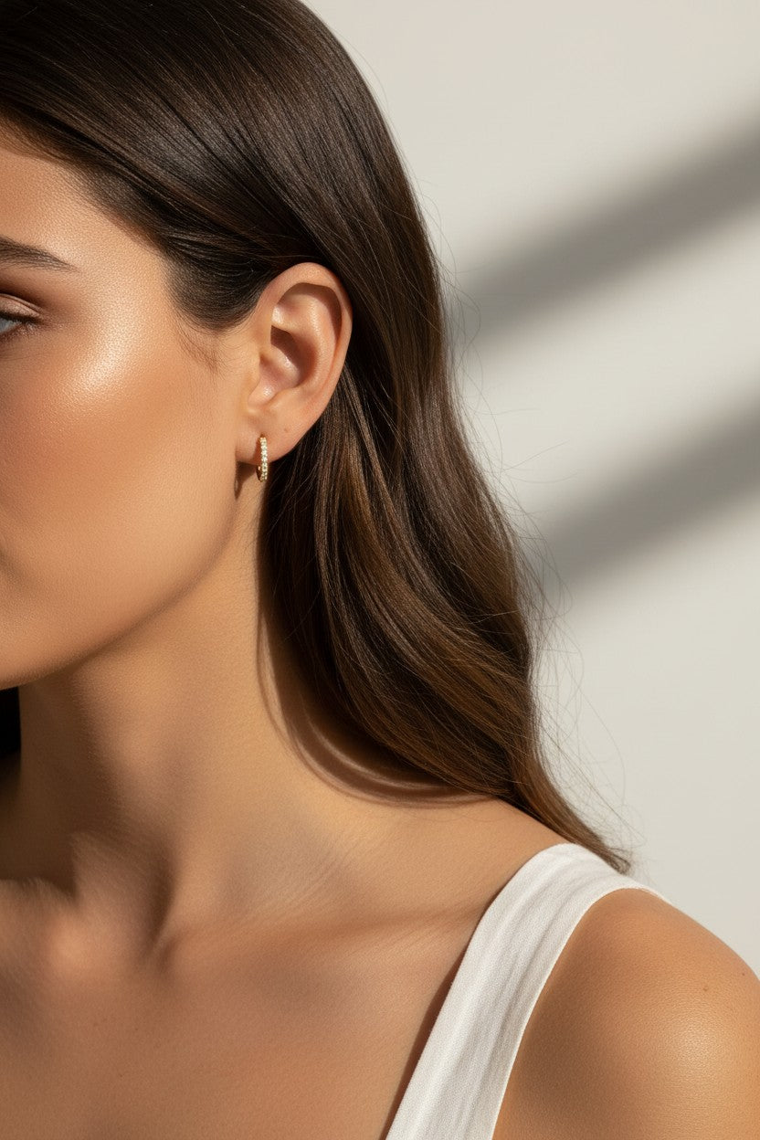 pavé huggie hoop earrings, gold huggie earrings on model, stacked hoop earrings, small pavé hoop earrings, everyday gold hoops, ear stack earrings, sparkle huggie hoops, minimalist gold hoops