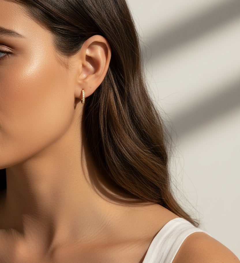 pavé huggie hoop earrings, gold huggie earrings on model, stacked hoop earrings, small pavé hoop earrings, everyday gold hoops, ear stack earrings, sparkle huggie hoops, minimalist gold hoops
