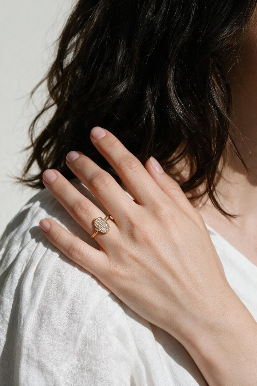 hamsa ring, pavé hamsa hand ring, crystal hamsa ring, gold hamsa jewelry, dainty symbol ring, protective charm ring, minimalist stacking ring, hamsa ring on model