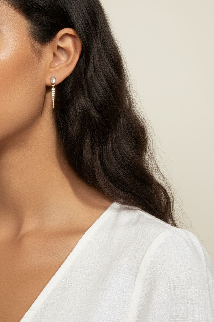 baguette crystal earrings, crystal drop earrings, pave drop earrings gold, dainty crystal earrings, statement drop earrings, sparkly stud and drop earrings, 18K gold overlay earrings, crystal earrings on-model