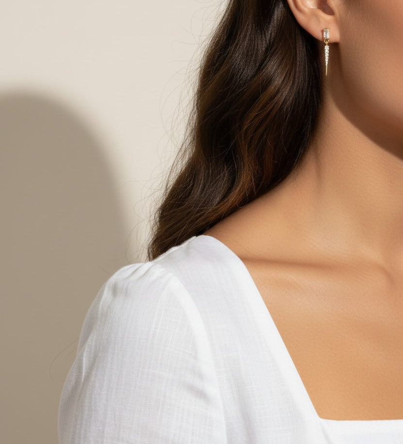 baguette crystal earrings, crystal drop earrings, pave drop earrings gold, dainty crystal earrings, statement drop earrings, sparkly stud and drop earrings, 18K gold overlay earrings, crystal earrings on-model