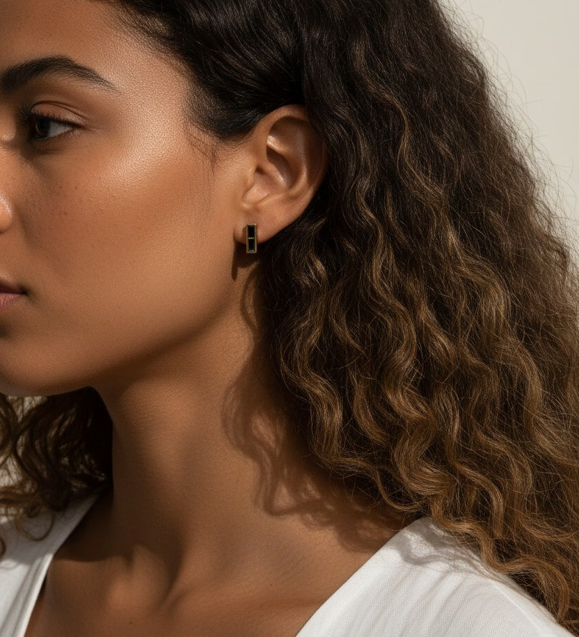 gold bar stud earrings on model, baguette stud earrings worn, emerald bar earrings styled, black baguette stud earrings, clear crystal bar earrings on ear, geometric stud earrings lifestyle, minimalist gold studs worn
