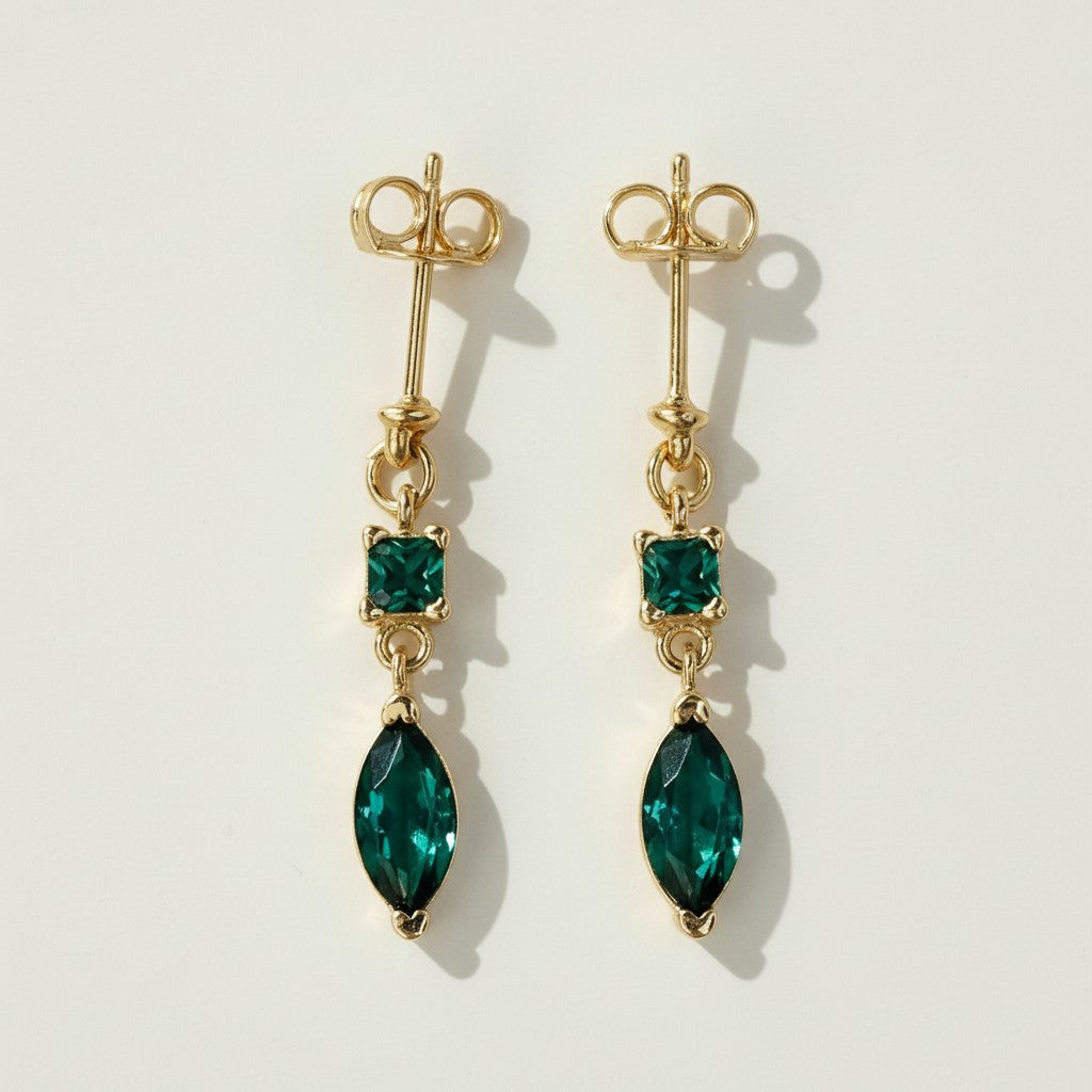 gold drop earrings colored stone, emerald marquise earrings, black onyx drop earrings gold, statement dangle earrings, two-tone gemstone earrings, gold prong set earrings, marquise cut earrings
