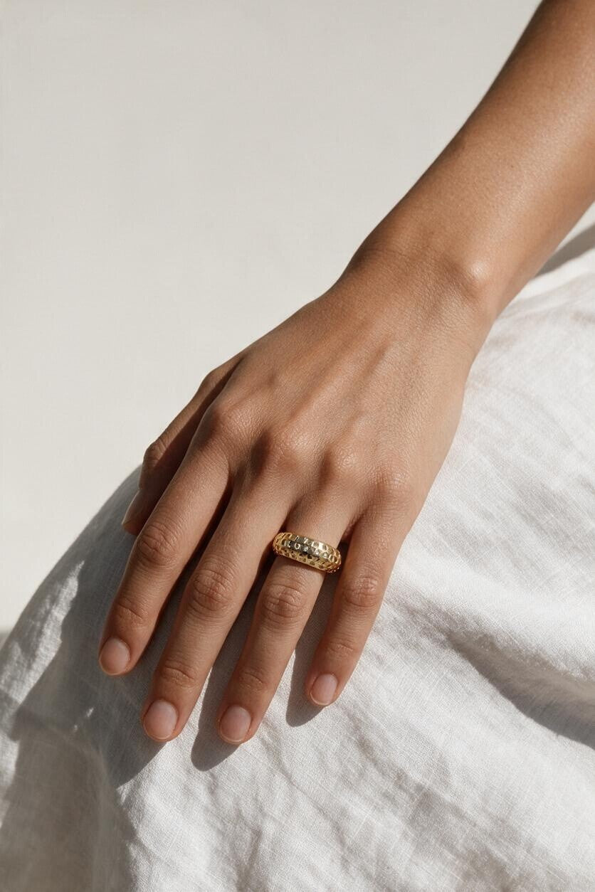 chunky gold dome ring on hand, crystal dome ring, wide gold band ring, statement gold ring, sparkly dome ring, cubic zirconia band ring, thick gold ring, scattered crystal ring, gold stacking ring, bold gold ring, matching ring and earrings, women’s chunky ring