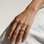 chunky gold dome ring on hand, crystal dome ring, wide gold band ring, statement gold ring, sparkly dome ring, cubic zirconia band ring, thick gold ring, scattered crystal ring, gold stacking ring, bold gold ring, matching ring and earrings, women’s chunky ring