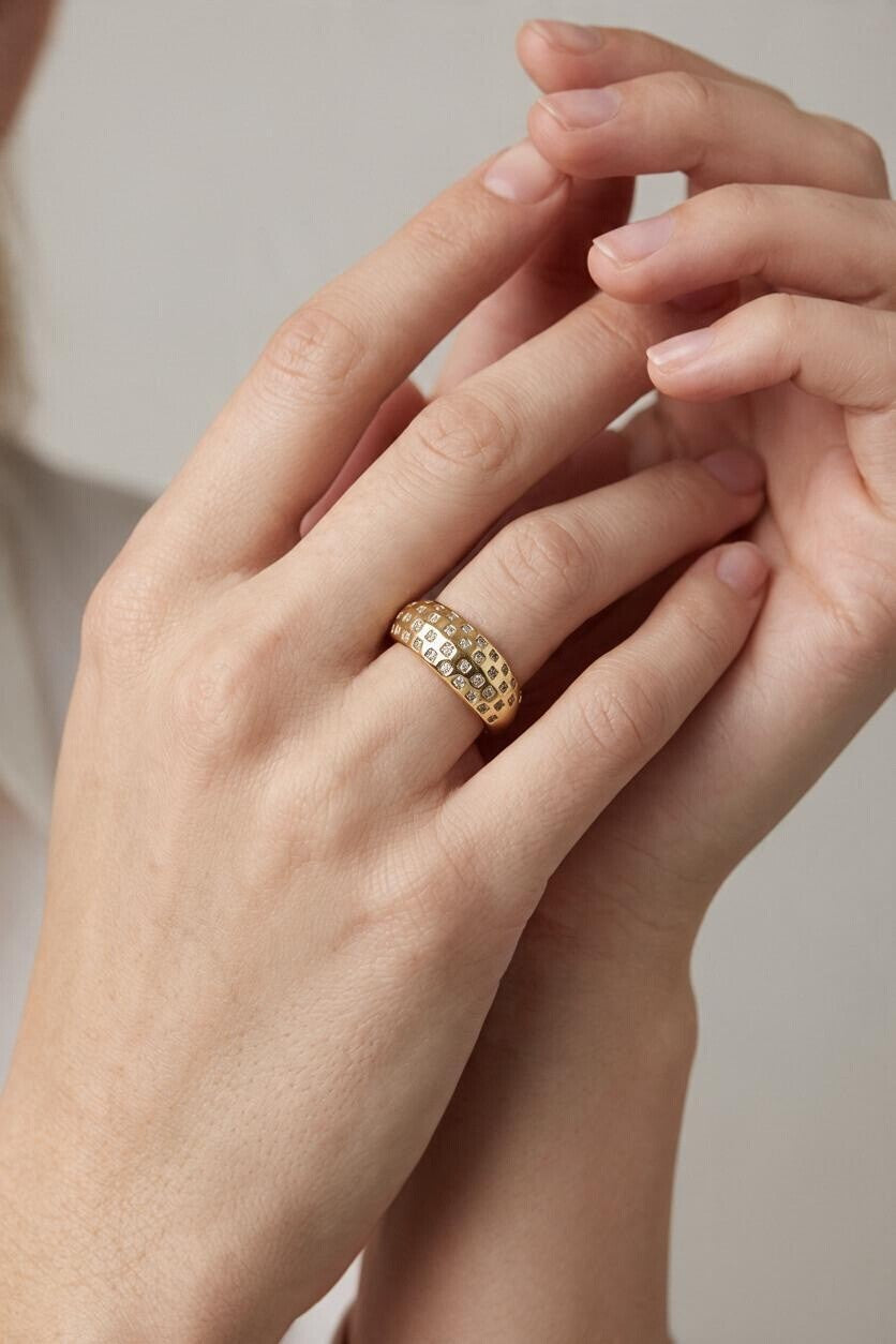 chunky gold dome ring on hand, crystal dome ring, wide gold band ring, statement gold ring, sparkly dome ring, cubic zirconia band ring, thick gold ring, scattered crystal ring, gold stacking ring, bold gold ring, matching ring and earrings, women’s chunky ring