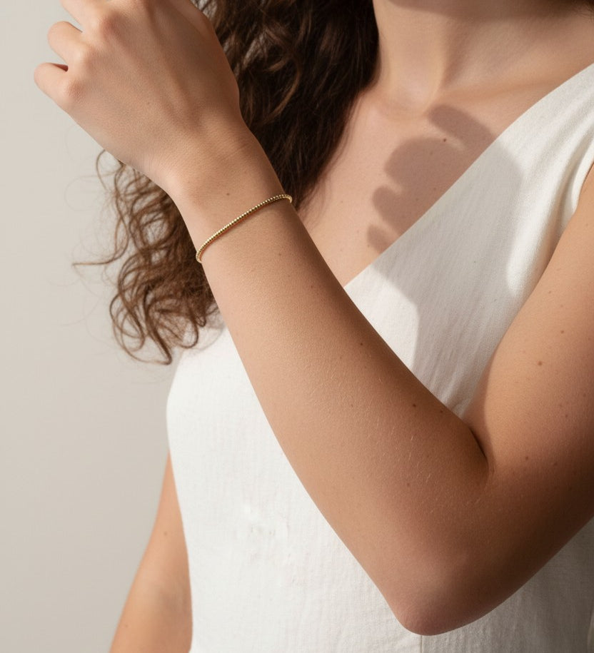 gold beaded bracelet, minimalist gold bracelet, dainty chain bracelet on model, textured gold bracelet, delicate beaded bracelet, everyday gold bracelet, layering bracelet gold, thin gold bracelet worn