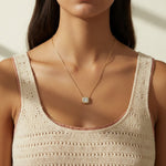 gold paperclip chain necklace, square halo pendant necklace, crystal pendant necklace on model, princess cut pendant necklace, pavé halo necklace, dainty gold necklace, gold-tone layering necklace, collarbone necklace, everyday gold necklace, minimalist pendant necklace, gift for her jewelry, scoop neck necklace