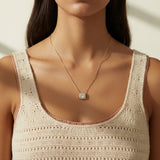 gold paperclip chain necklace, square halo pendant necklace, crystal pendant necklace on model, princess cut pendant necklace, pavé halo necklace, dainty gold necklace, gold-tone layering necklace, collarbone necklace, everyday gold necklace, minimalist pendant necklace, gift for her jewelry, scoop neck necklace