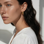 chunky gold huggie hoop earrings, gold dome hoop earrings, thick gold hoops, small gold hoop earrings, everyday gold hoops, polished gold huggies, lightweight chunky hoops, minimalist gold earrings, classic hoop earrings, earrings for stacking, gift for her, gold hoop earrings on model