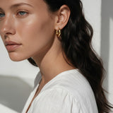 chunky gold huggie hoop earrings, gold dome hoop earrings, thick gold hoops, small gold hoop earrings, everyday gold hoops, polished gold huggies, lightweight chunky hoops, minimalist gold earrings, classic hoop earrings, earrings for stacking, gift for her, gold hoop earrings on model