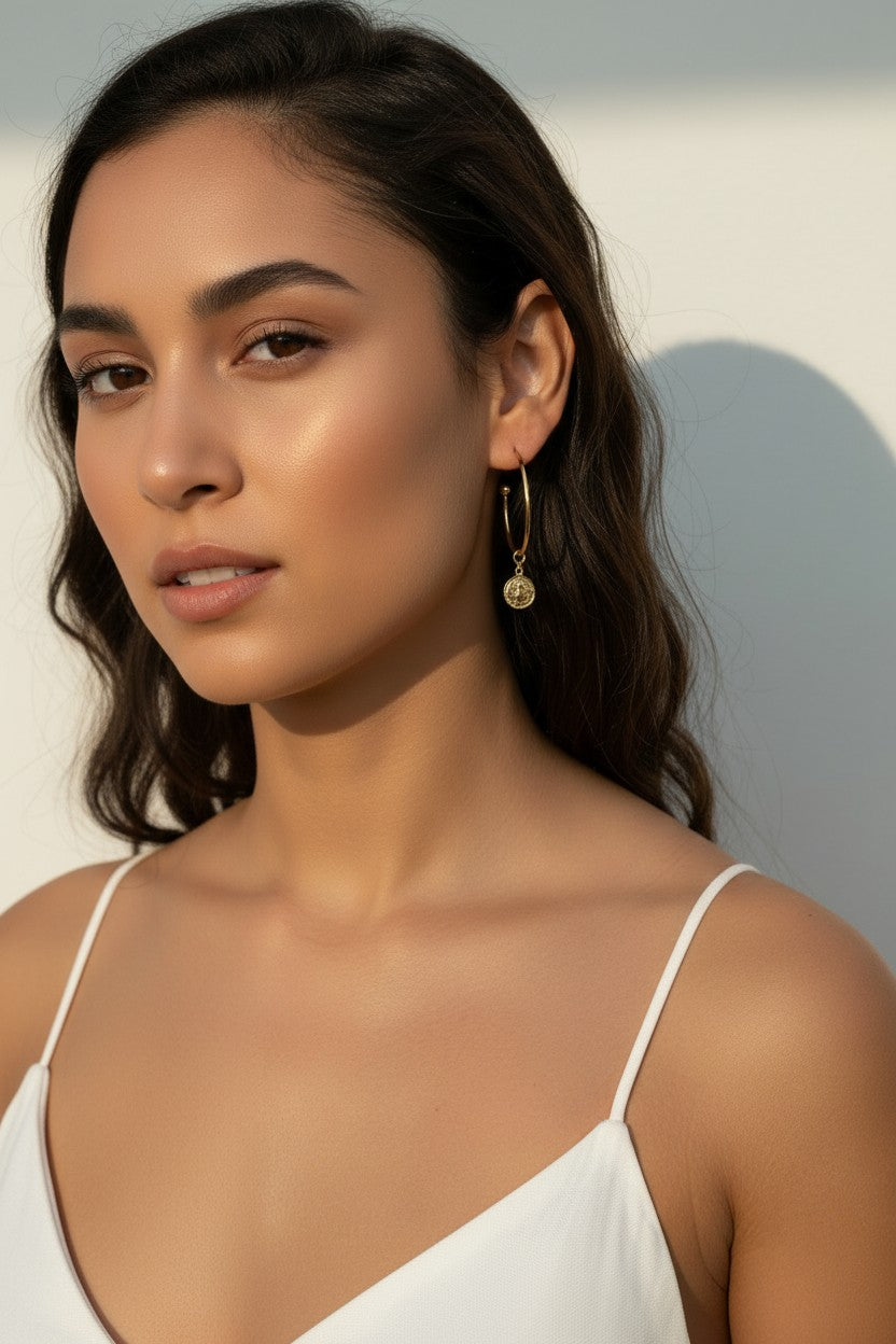 gold coin charm earrings, coin hoop earrings, gold hoop earrings with charm, vintage coin jewelry, dangle hoop earrings, everyday gold earrings, medallion earrings, on-model earring photography