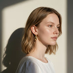 gold flat hoop earrings on model, wide band hoop earrings, medium gold hoop earrings, textured gold hoops, polished gold hoop earrings, modern hoop earrings, statement hoops, everyday gold hoops, minimalist hoop earrings, hoop earrings for bob hair, gift for her, linen summer style jewelry