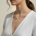 single pearl necklace, pearl pendant necklace, gold chain pearl necklace, minimalist pearl jewelry, classic pearl necklace, everyday pearl necklace, floating pearl necklace, on-model necklace photography