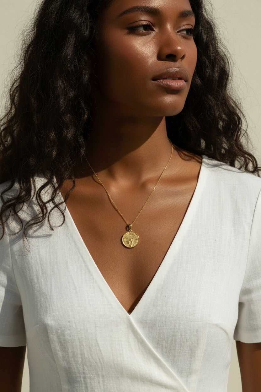 gold wishbone necklace, compass coin pendant necklace, medallion necklace gold, symbolic jewelry, vintage coin necklace, textured gold necklace, lucky charm necklace, layering necklace