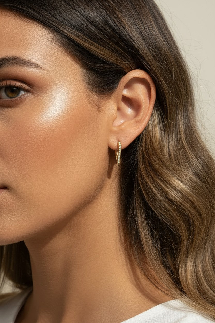  gold triangle huggie earrings, geometric pave earrings, angular gold hoop earrings, crystal huggie hoops, statement geometric earrings gold, modern triangle earrings, pave crystal huggies