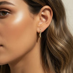  gold triangle huggie earrings, geometric pave earrings, angular gold hoop earrings, crystal huggie hoops, statement geometric earrings gold, modern triangle earrings, pave crystal huggies