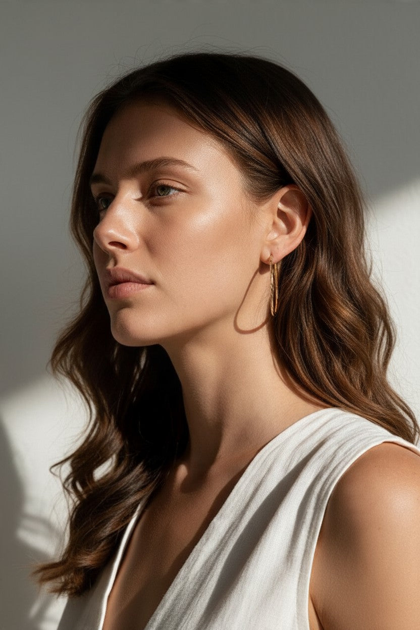 gold hoop earrings on model, textured gold hoops, thin endless hoop earrings, diamond-cut hoop earrings, lightweight hoop earrings, medium gold hoops, minimalist gold hoops, everyday hoop earrings, sleeper hoops, twist hoop earrings, women’s gold hoops, elegant everyday earrings