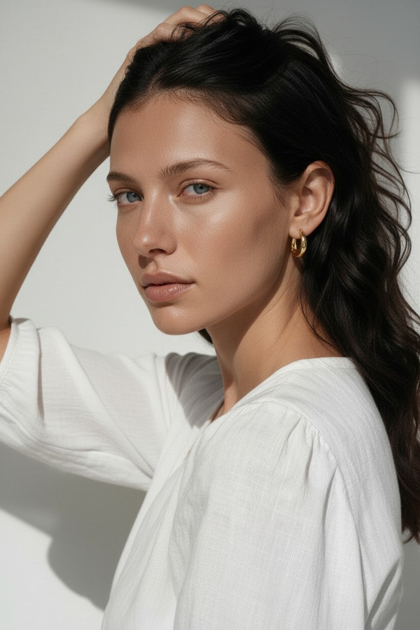 chunky gold huggie hoop earrings, gold dome hoop earrings, thick gold hoops, small gold hoop earrings, everyday gold hoops, polished gold huggies, lightweight chunky hoops, minimalist gold earrings, classic hoop earrings, earrings for stacking, gift for her, gold hoop earrings on model