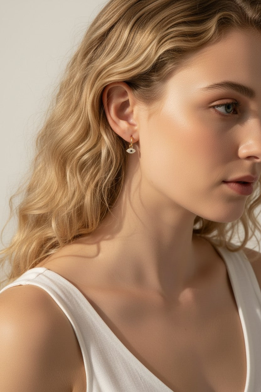 evil eye hoop earrings, gold evil eye charm earrings, 18k gold overlay hoops, pave cubic zirconia earrings, Donna Italiana jewelry, hypoallergenic gold earrings, waterproof gold jewelry, small gold hoop earrings, dainty charm hoops
