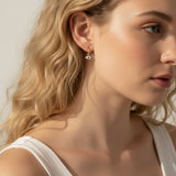evil eye hoop earrings, gold evil eye charm earrings, 18k gold overlay hoops, pave cubic zirconia earrings, Donna Italiana jewelry, hypoallergenic gold earrings, waterproof gold jewelry, small gold hoop earrings, dainty charm hoops