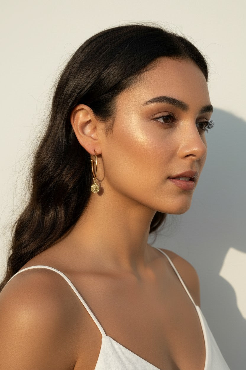 gold coin charm earrings, coin hoop earrings, gold hoop earrings with charm, vintage coin jewelry, dangle hoop earrings, everyday gold earrings, medallion earrings, on-model earring photography