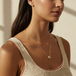gold paperclip chain necklace, square halo pendant necklace, crystal pendant necklace on model, princess cut pendant necklace, pavé halo necklace, dainty gold necklace, gold-tone layering necklace, collarbone necklace, everyday gold necklace, minimalist pendant necklace, gift for her jewelry, scoop neck necklace