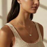 gold paperclip chain necklace, square halo pendant necklace, crystal pendant necklace on model, princess cut pendant necklace, pavé halo necklace, dainty gold necklace, gold-tone layering necklace, collarbone necklace, everyday gold necklace, minimalist pendant necklace, gift for her jewelry, scoop neck necklace